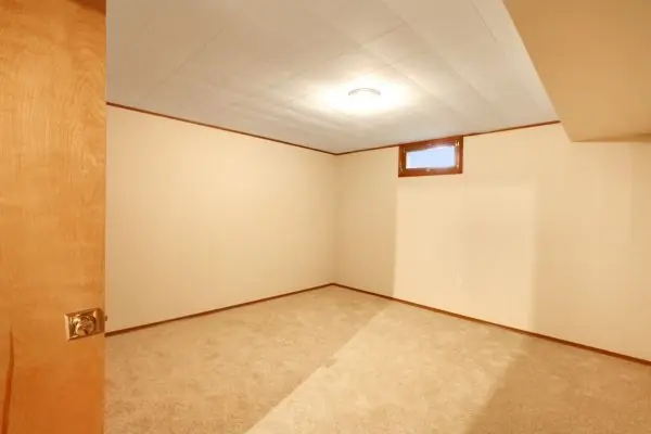 empty basement room with flooring and ceiling