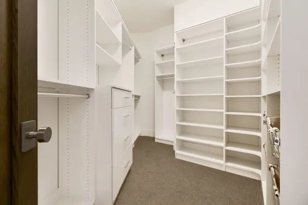 large cabinetry leading to closet
