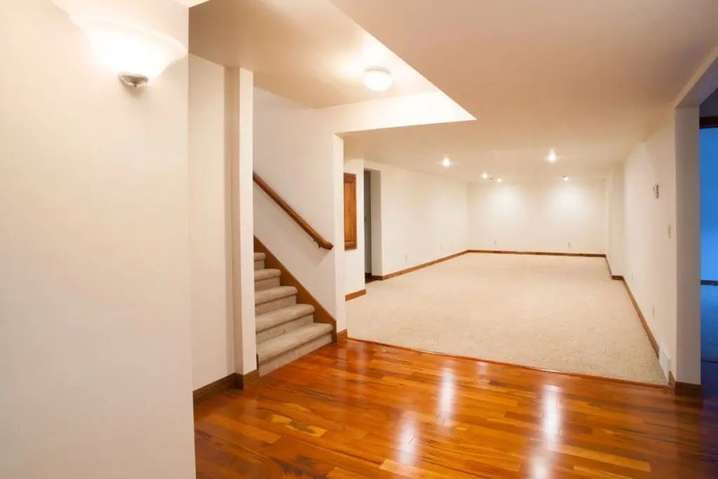 spacious finished basement with carpet and hardwood floors