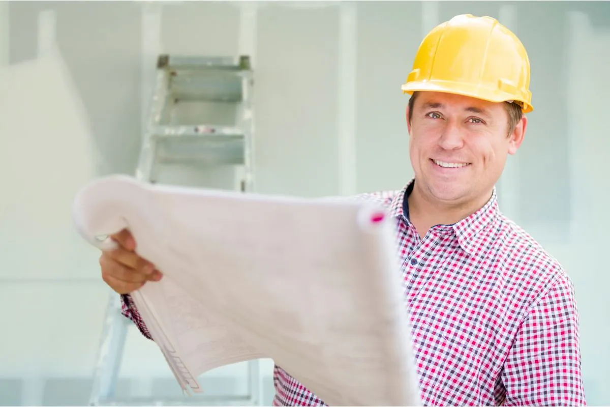 basement contractor holding blueprint