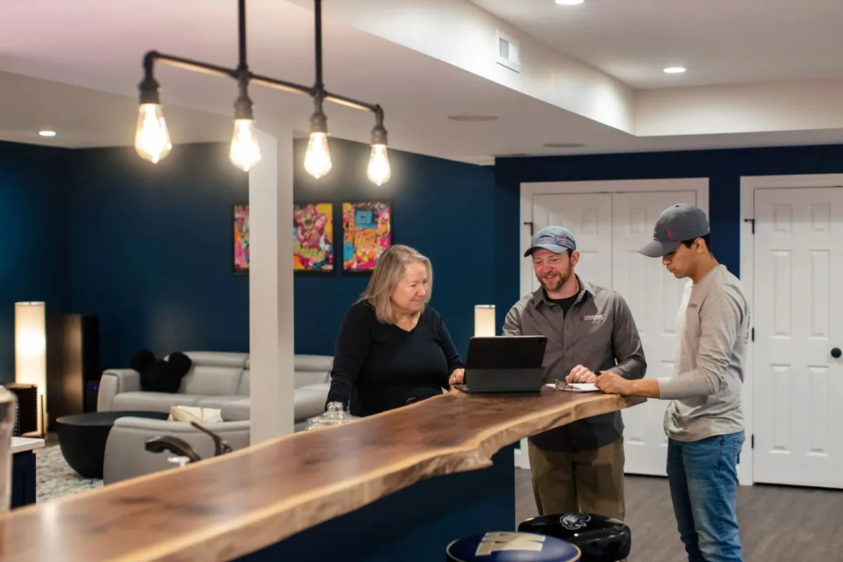 home owner talking to two contractors in the basement