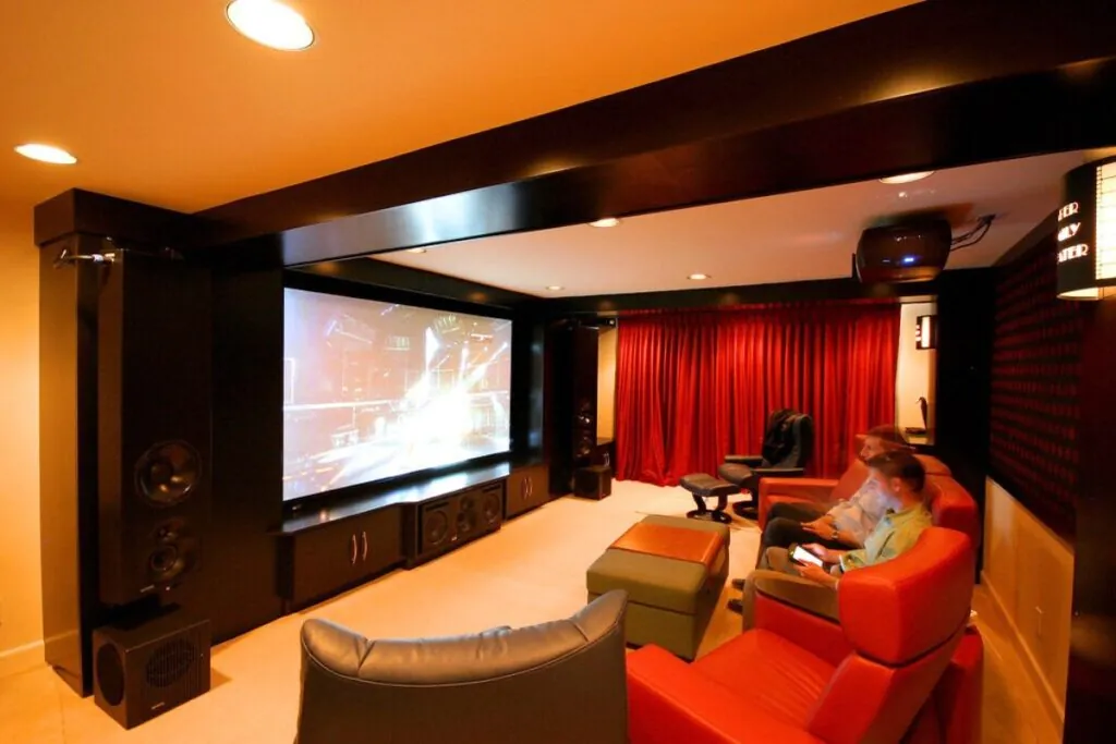 two people watching movies on basement home theater